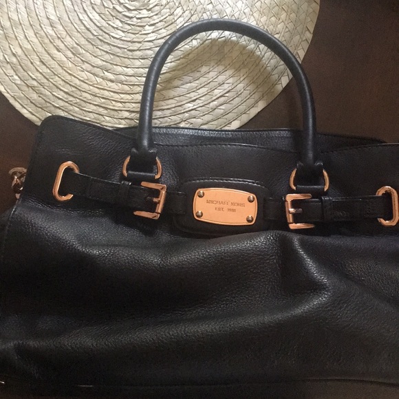 black and rose gold purse